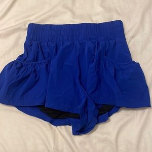 Free people movement get your flirt on blue shorts size small never been worn